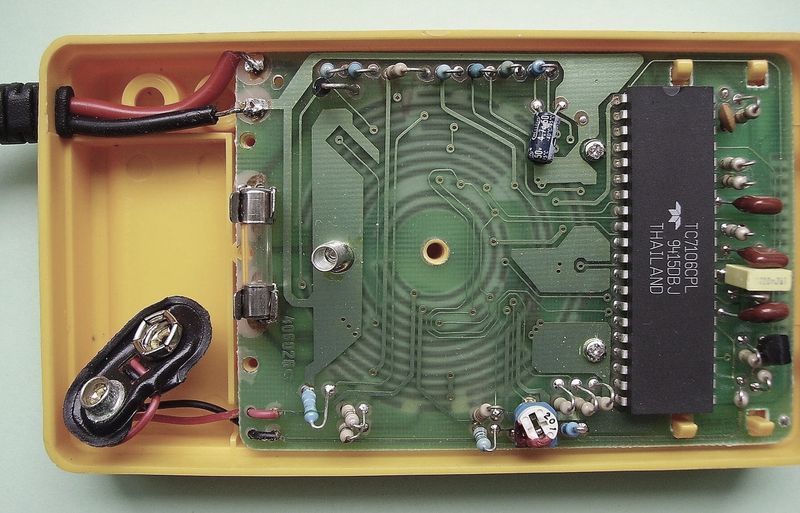 Close view of a printed circuit board showing routed copper traces between components