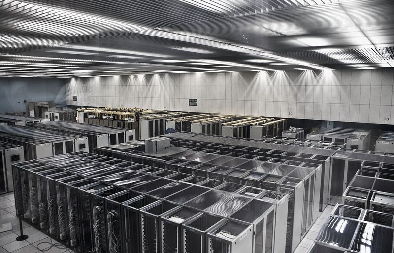 Rows of rack-mounted servers with patch cabling, photographed at CERN